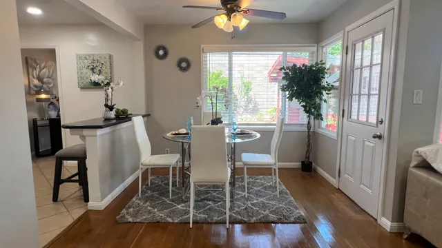 a kitchen with stainless steel appliances granite countertop a sink and a refrigerator