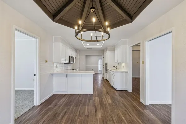 a kitchen with a hard wood floor