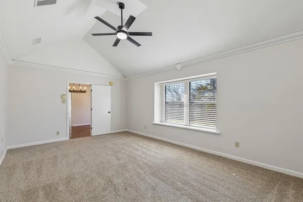 a view of an empty room with a window
