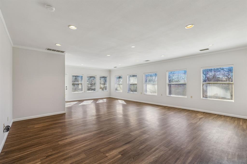 608 Knightsbridge Road Willow Park, TX 76087 - Photo 19 of 31 a view of an empty room with wooden floor and a window
