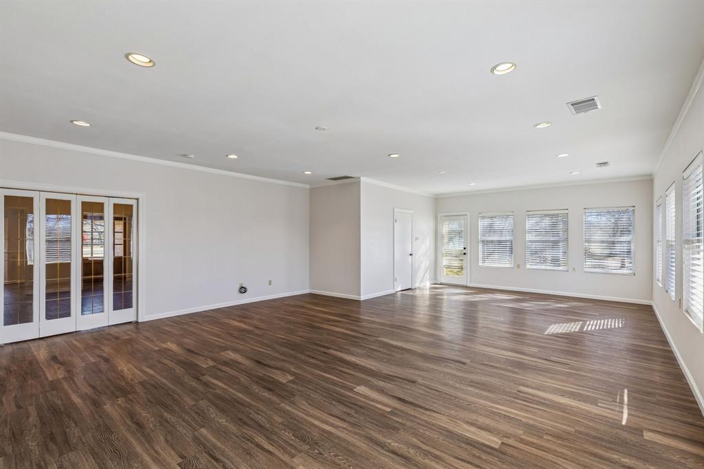 608 Knightsbridge Road Willow Park, TX 76087 - Photo 20 of 31 a view of an empty room with wooden floor and a window