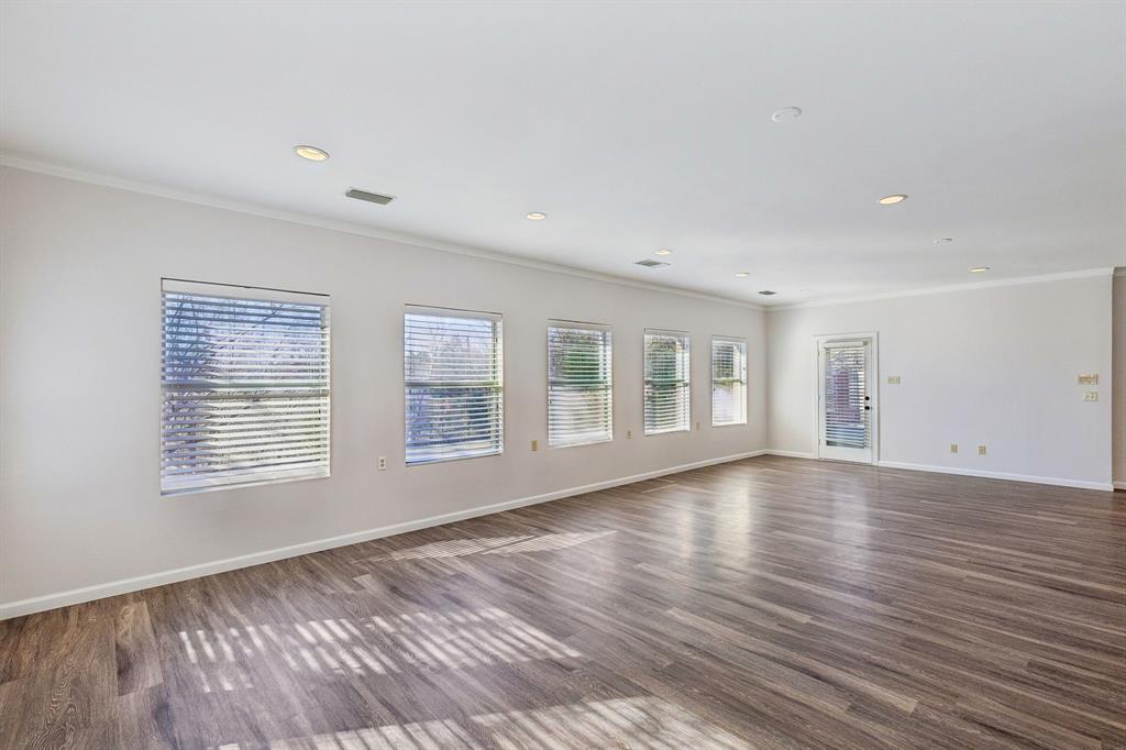 608 Knightsbridge Road Willow Park, TX 76087 - Photo 21 of 31 a view of an empty room with wooden floor and a window