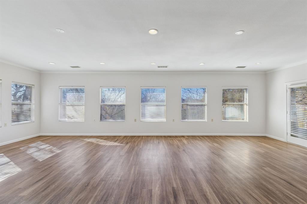 608 Knightsbridge Road Willow Park, TX 76087 - Photo 22 of 31 a view of an empty room with wooden floor and a window