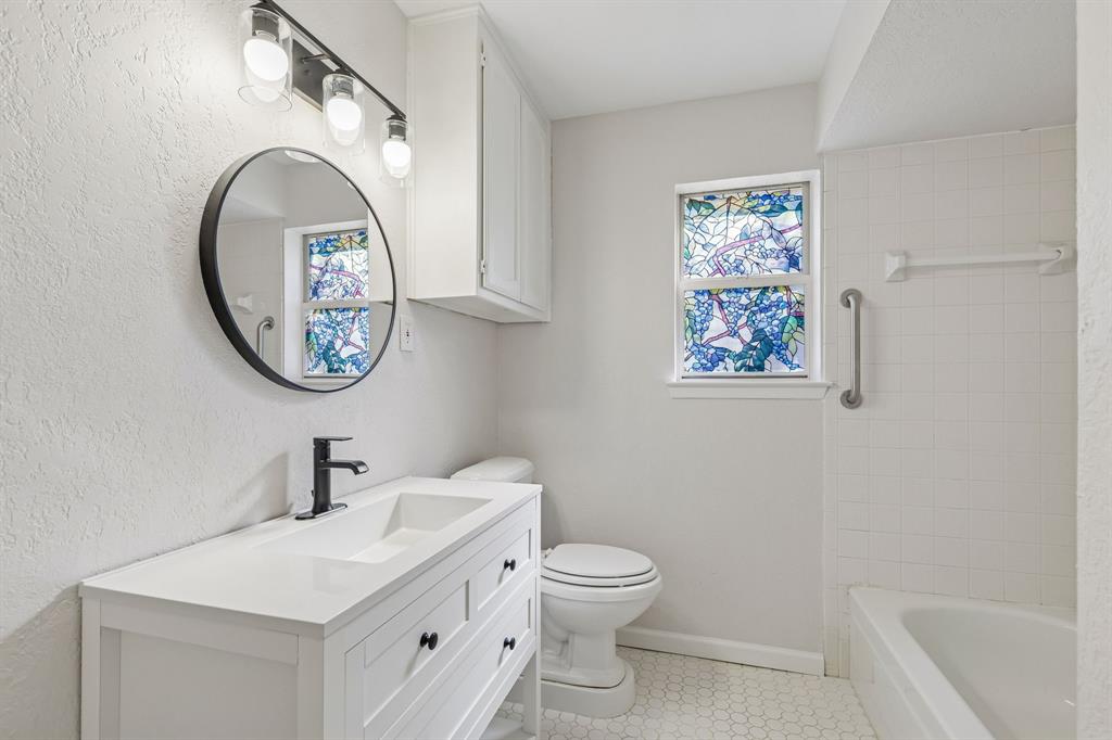 608 Knightsbridge Road Willow Park, TX 76087 - Photo 24 of 31 a bathroom with a toilet a sink and a mirror