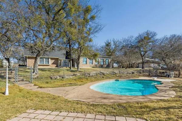 a view of a house with swimming pool