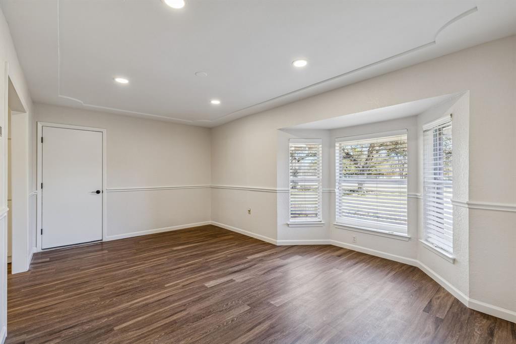 608 Knightsbridge Road Willow Park, TX 76087 - Photo 7 of 31 an empty room with wooden floor and windows