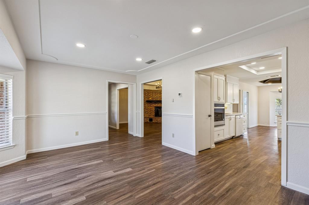 608 Knightsbridge Road Willow Park, TX 76087 - Photo 8 of 31 a view of a big room with wooden floor and windows