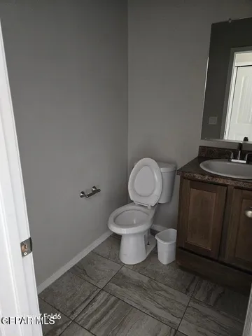 a bathroom with a toilet and a sink
