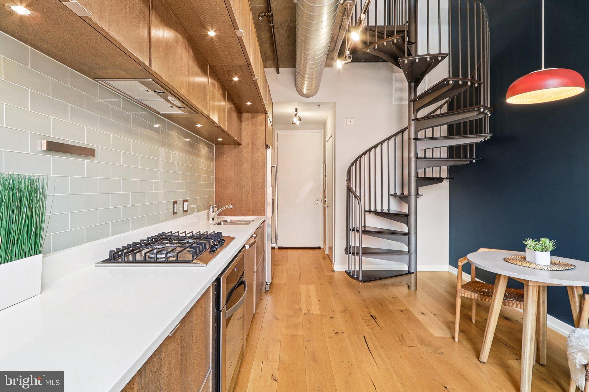 1515 15th Street Northwest, Unit 406A Washington, DC 20005 - Photo 6 of 26 a view of entryway and hall with wooden floor