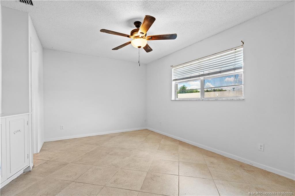 2118 Southeast Edler Drive, Unit B Stuart, FL 34994 - Photo 14 of 20 a view of an empty room with a window