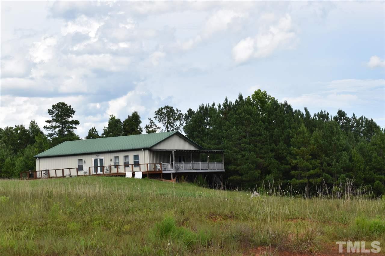 466 Vineyard Ridge Siler City, NC 27344 - Photo 1 of 29 a front view of a house with garden