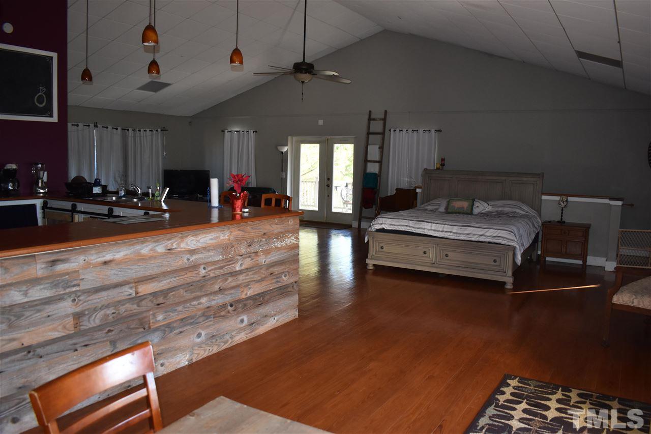 466 Vineyard Ridge Siler City, NC 27344 - Photo 13 of 29 a view of a room with gym equipment