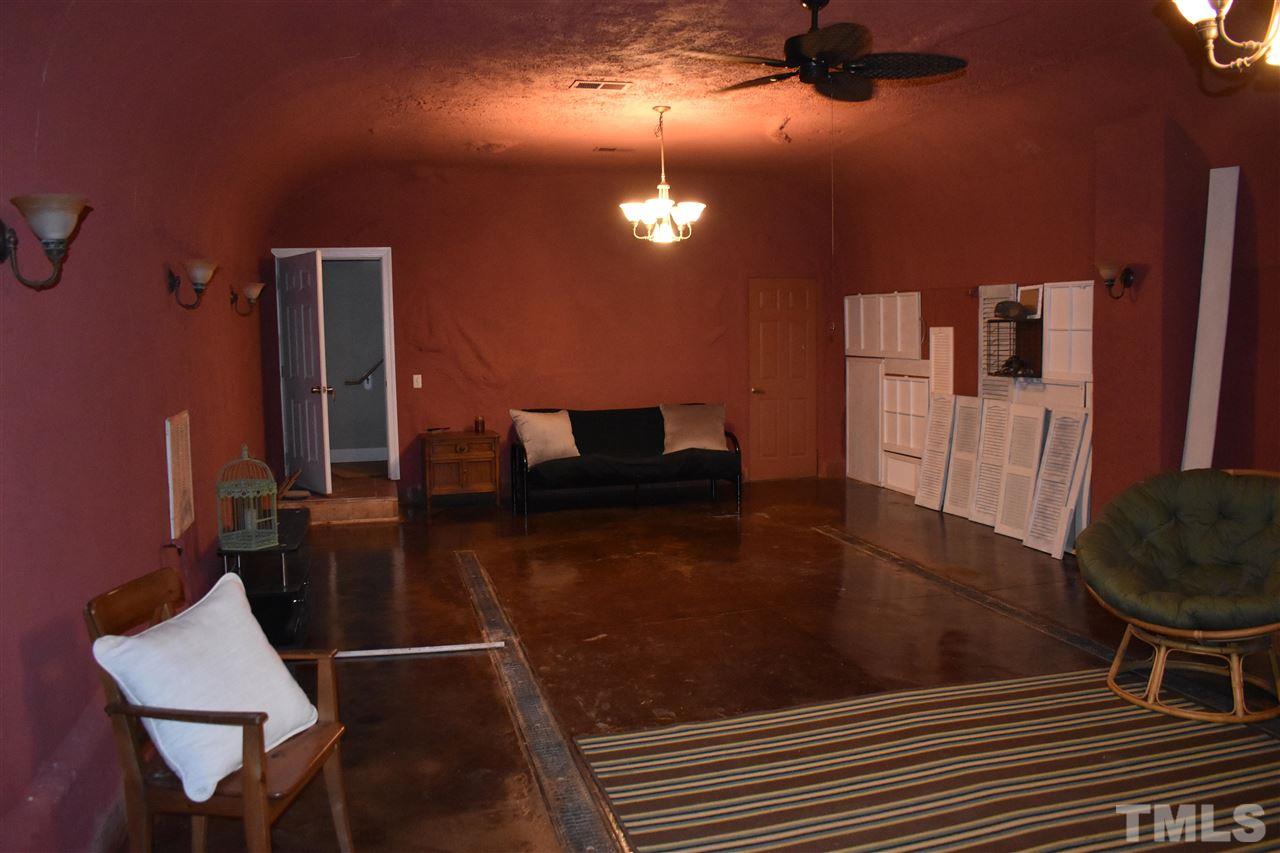 466 Vineyard Ridge Siler City, NC 27344 - Photo 17 of 29 a living room with furniture and a wooden floor