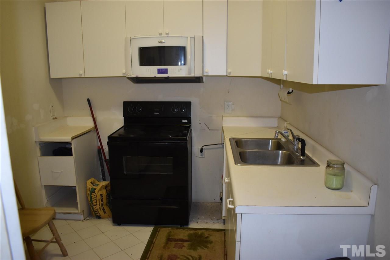 466 Vineyard Ridge Siler City, NC 27344 - Photo 21 of 29 a kitchen with a stove and a microwave