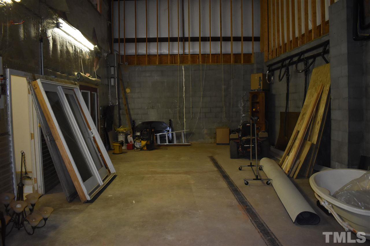 466 Vineyard Ridge Siler City, NC 27344 - Photo 22 of 29 a bathroom with a sink a toilet a mirror and shower