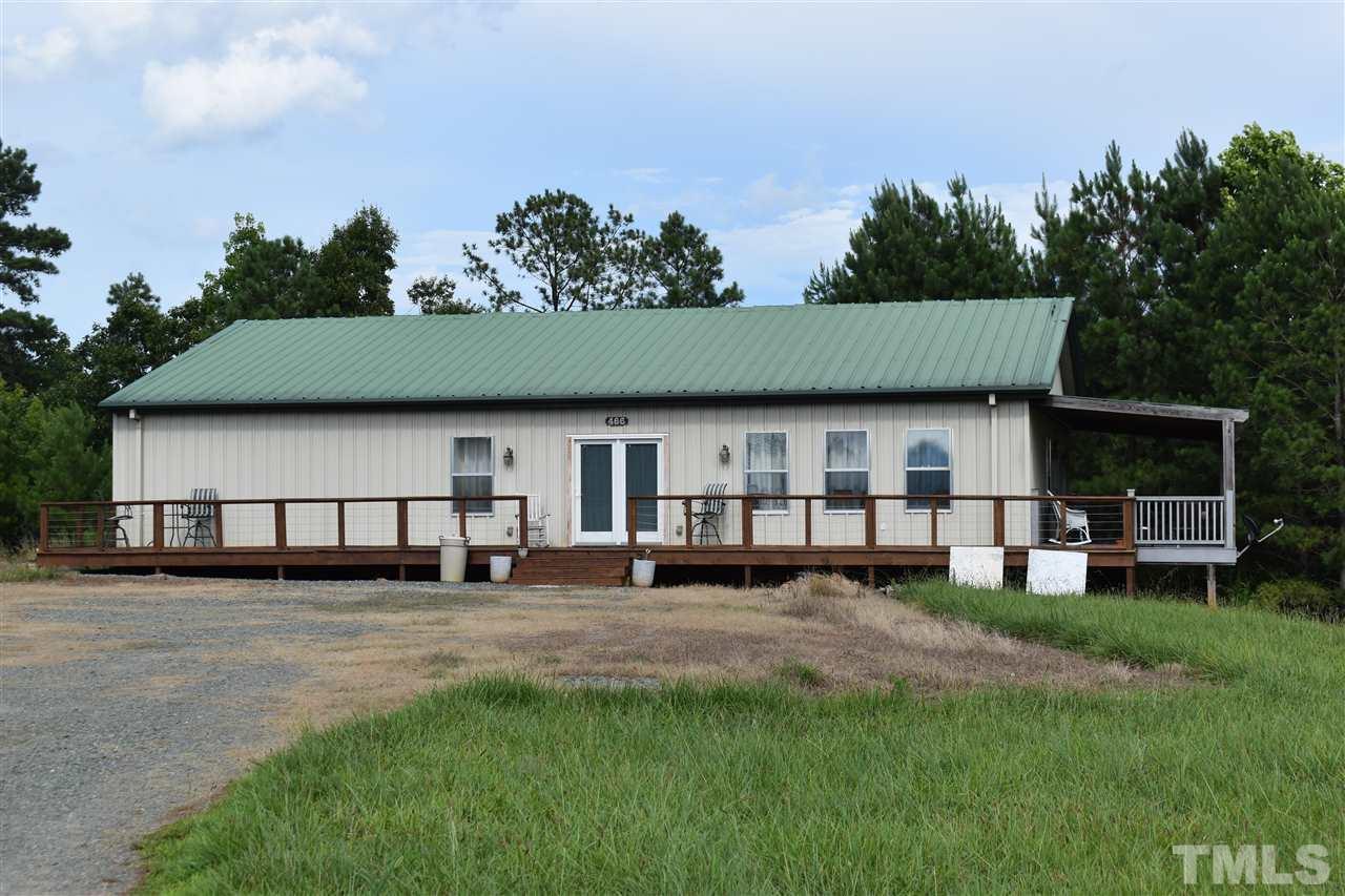 466 Vineyard Ridge Siler City, NC 27344 - Photo 24 of 29 a view of a house with a big yard and sitting area