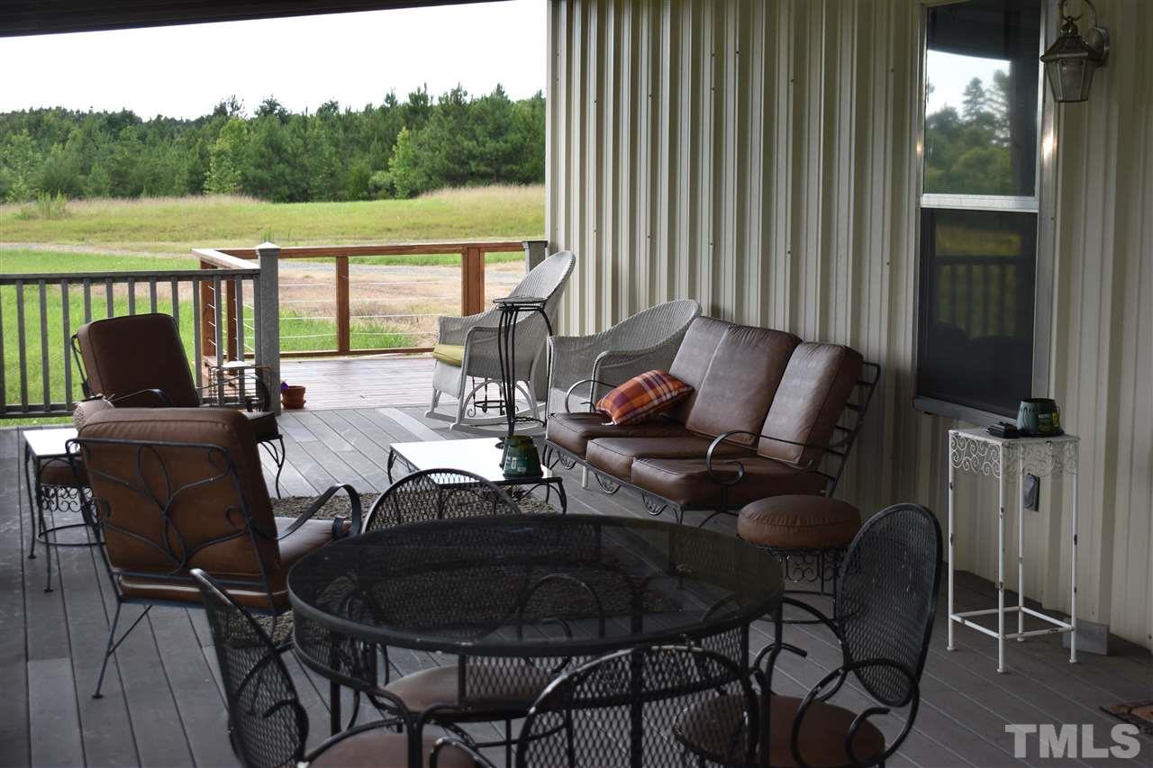 466 Vineyard Ridge Siler City, NC 27344 - Photo 5 of 29 a view of a chairs and table in patio