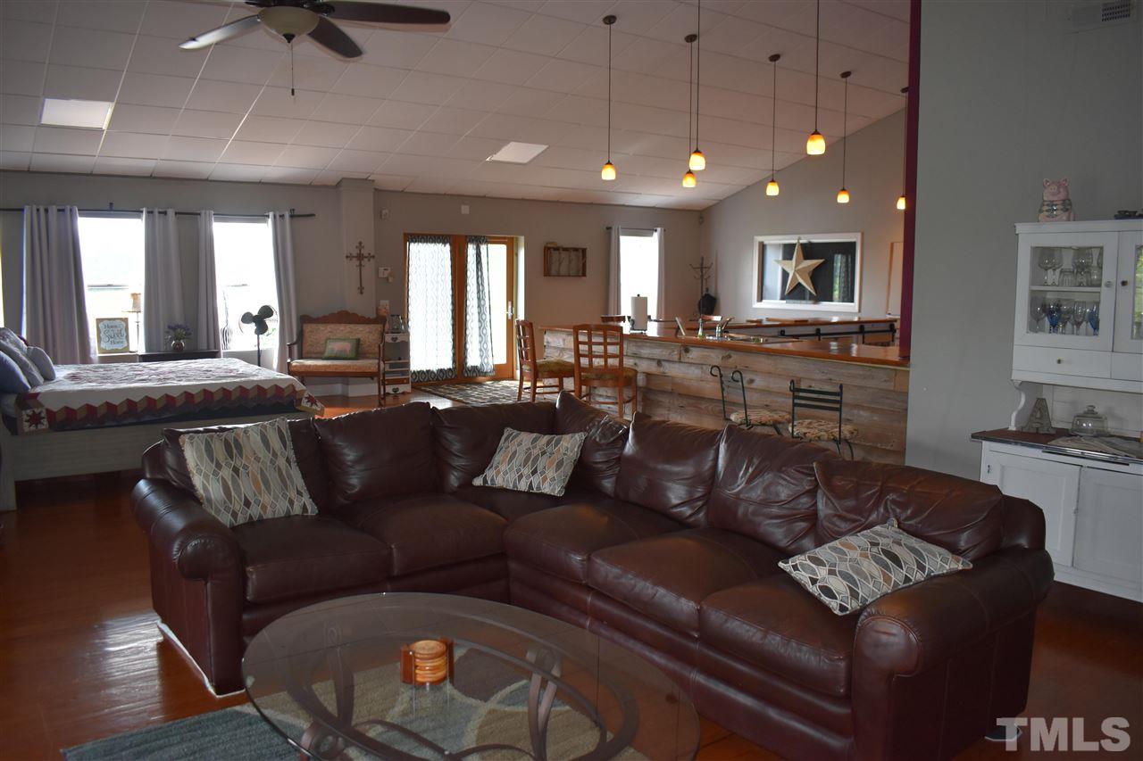 466 Vineyard Ridge Siler City, NC 27344 - Photo 6 of 29 a living room with furniture and a flat screen tv