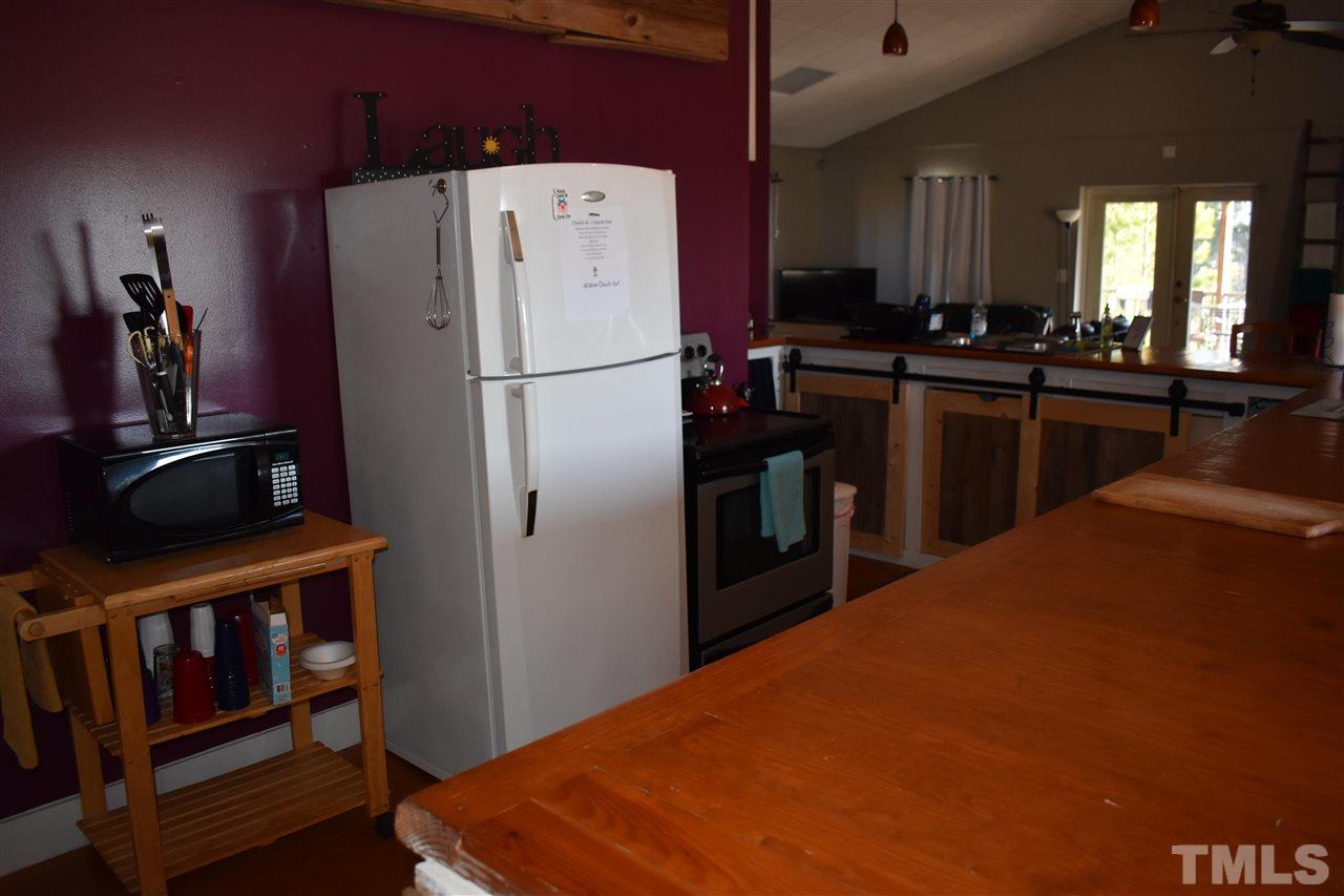 466 Vineyard Ridge Siler City, NC 27344 - Photo 10 of 29 a kitchen with refrigerator and window
