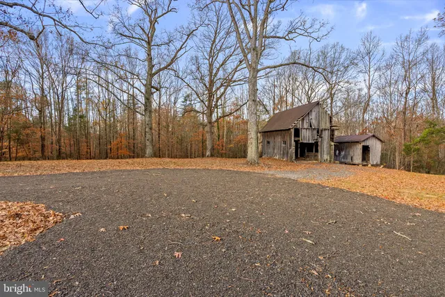a pathway of a house with a yard