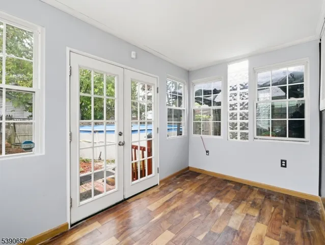 a view of an empty room with windows