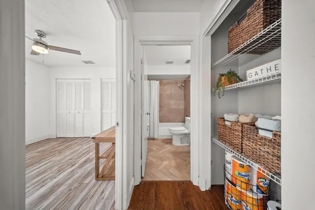 a bedroom with a bed and a potted plant