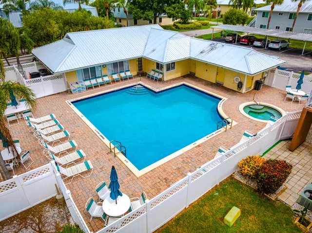 a view of a balcony with an outdoor space and seating area