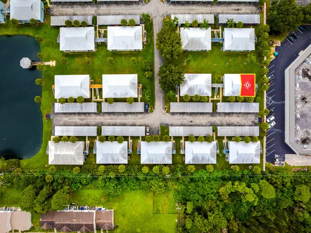 an aerial view of residential houses with outdoor space