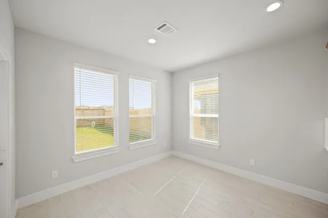 an empty room with windows