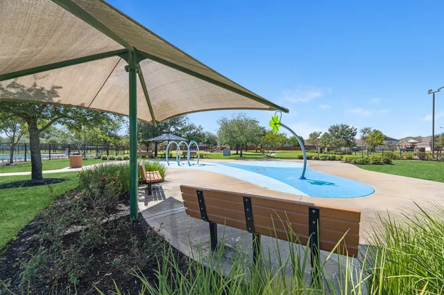 a view of backyard with swimming pool and outdoor