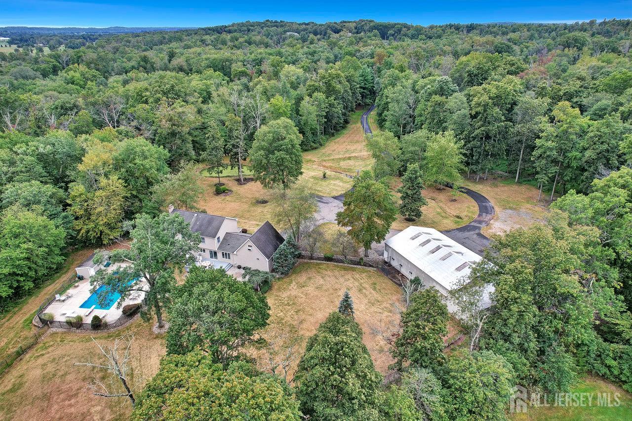 526 County Road, Unit 579 Ringoes, NJ 08551 - Photo 11 of 51 an aerial view of a house with a yard