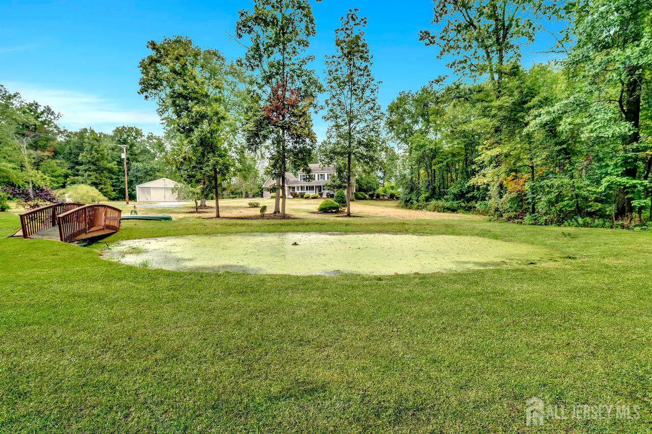 526 County Road, Unit 579 Ringoes, NJ 08551 - Photo 19 of 51 a backyard of a house with a table and chairs