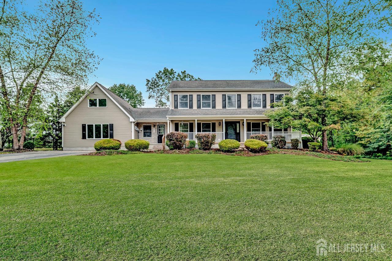 526 County Road, Unit 579 Ringoes, NJ 08551 - Photo 2 of 51 a front view of a house with a garden