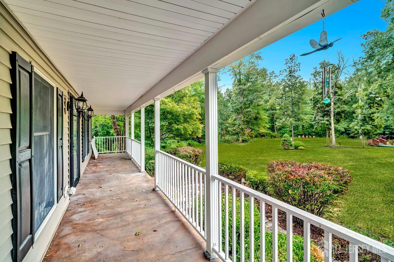 526 County Road, Unit 579 Ringoes, NJ 08551 - Photo 24 of 51 a view of a porch with wooden floor and roof