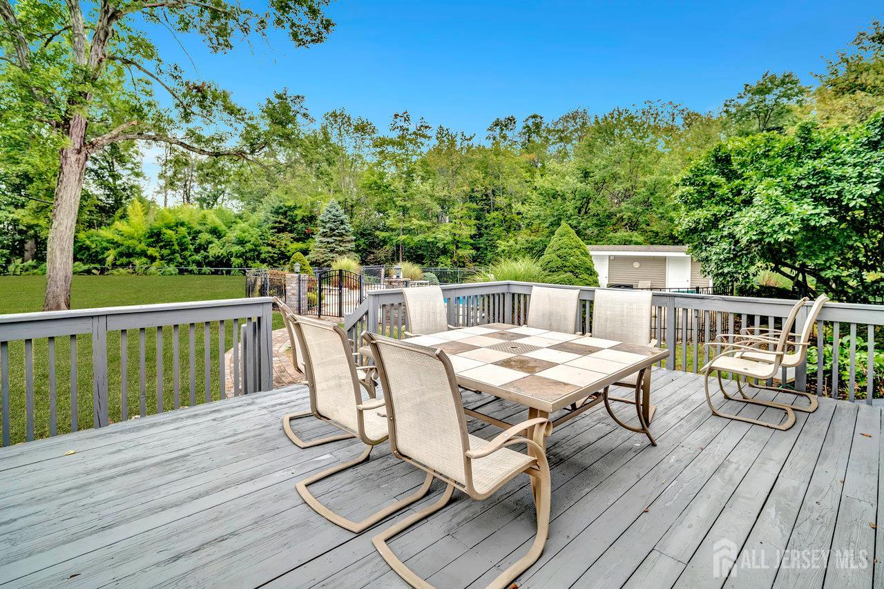 526 County Road, Unit 579 Ringoes, NJ 08551 - Photo 29 of 51 a view of a balcony with wooden floor and outdoor seating
