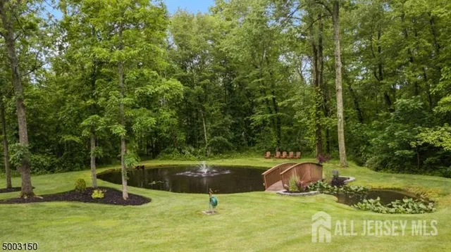 a view of a garden with wooden deck