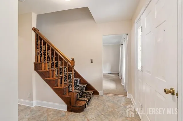 a kitchen with a sink stainless steel appliances and cabinets