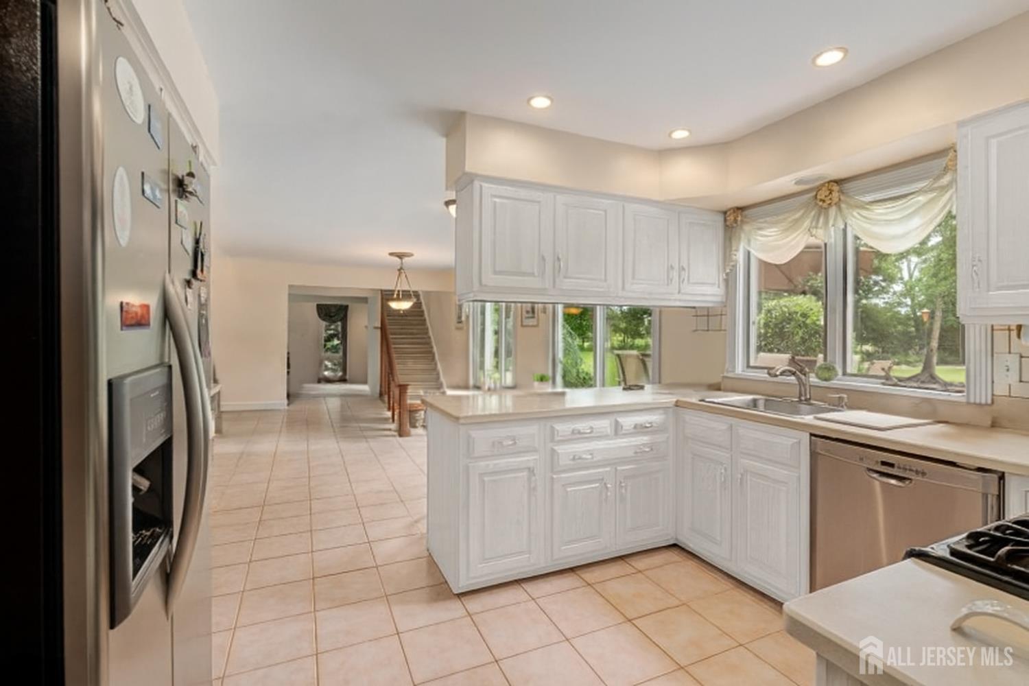 526 County Road, Unit 579 Ringoes, NJ 08551 - Photo 36 of 51 a kitchen with a sink stainless steel appliances and cabinets