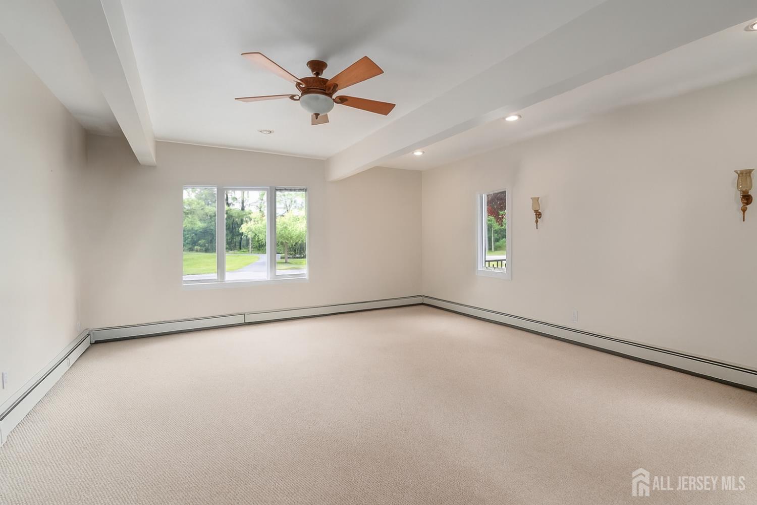 526 County Road, Unit 579 Ringoes, NJ 08551 - Photo 41 of 51 an empty room with windows and fan