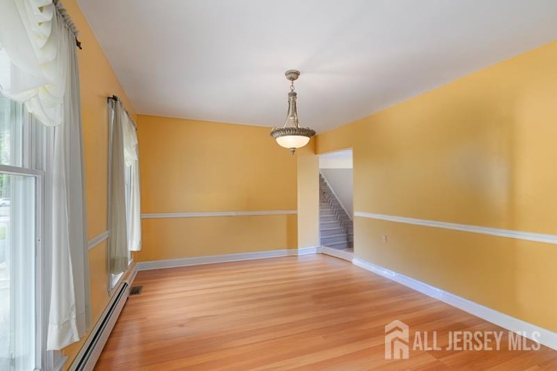 526 County Road, Unit 579 Ringoes, NJ 08551 - Photo 51 of 51 a view of an empty room with wooden floor and a window