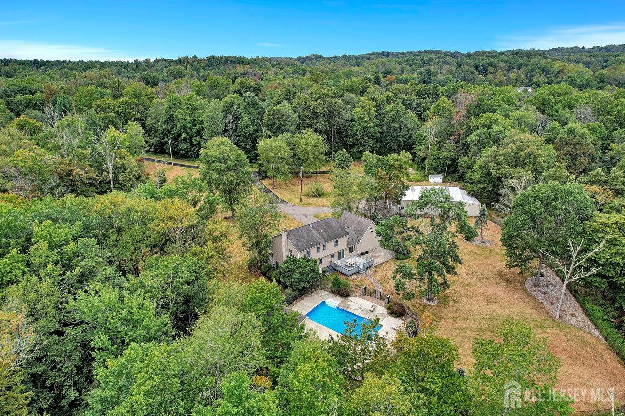 526 County Road, Unit 579 Ringoes, NJ 08551 - Photo 9 of 51 an aerial view of a house with a yard