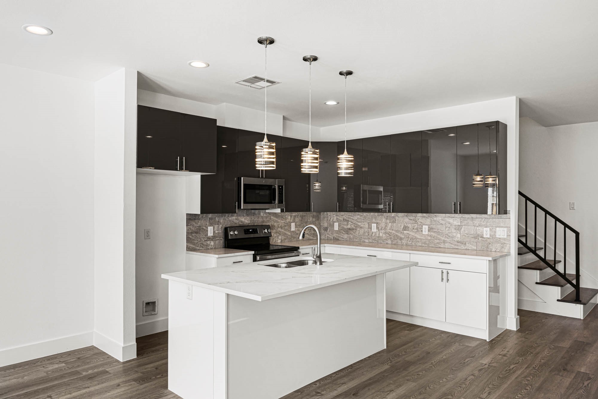 4512 Noble Street Houston, TX 77020 - Photo 6 of 16 a kitchen with cabinets a sink and appliances