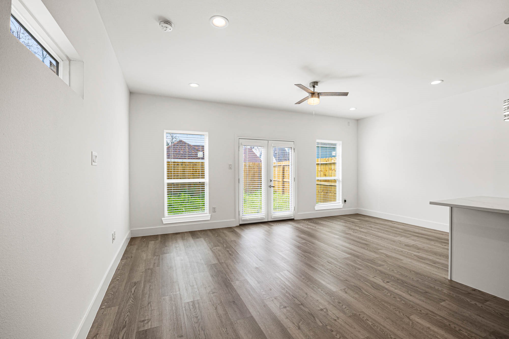 4512 Noble Street Houston, TX 77020 - Photo 9 of 16 wooden floor in an empty room with a window