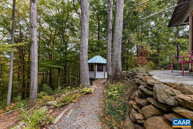 a view of balcony with wooden floor and fence