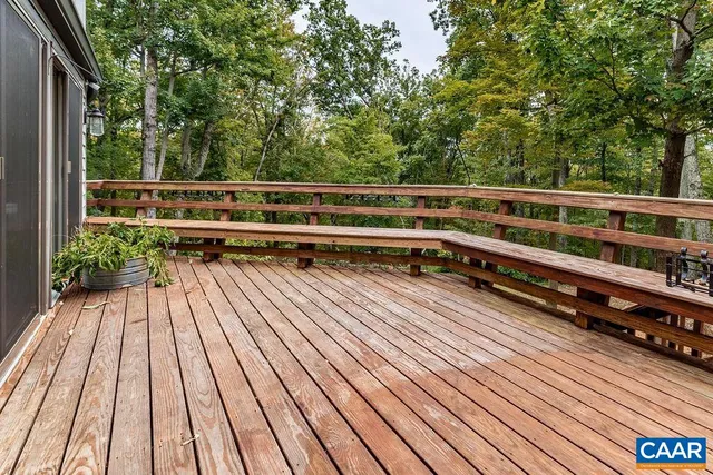 a kitchen with granite countertop a sink and a wooden floor