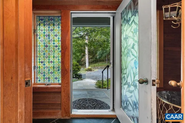 a kitchen with kitchen island stainless steel appliances a sink and a counter top space