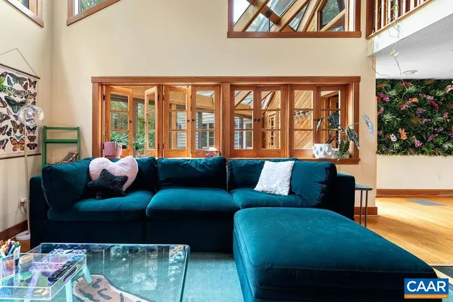 an empty room with wooden floor and a window