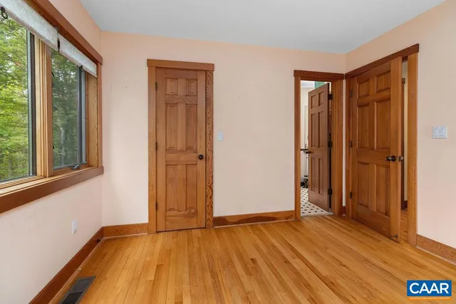 a view of a kitchen with racks on the wall