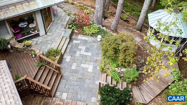a view of a house with backyard and deck