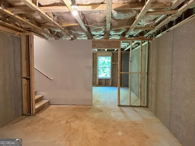 a view of a room with wooden walls